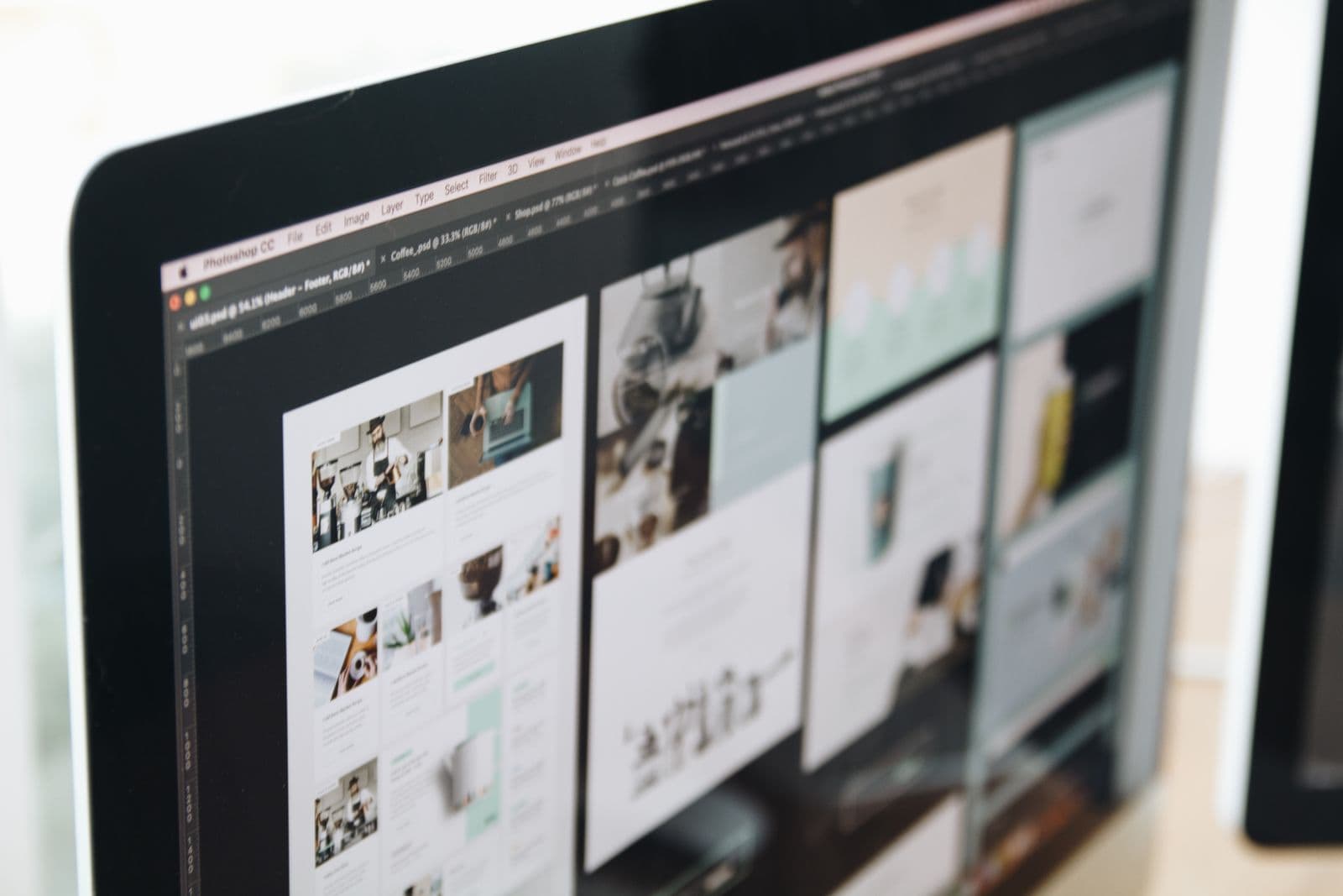 Designer reviewing a responsive website layout across devices
