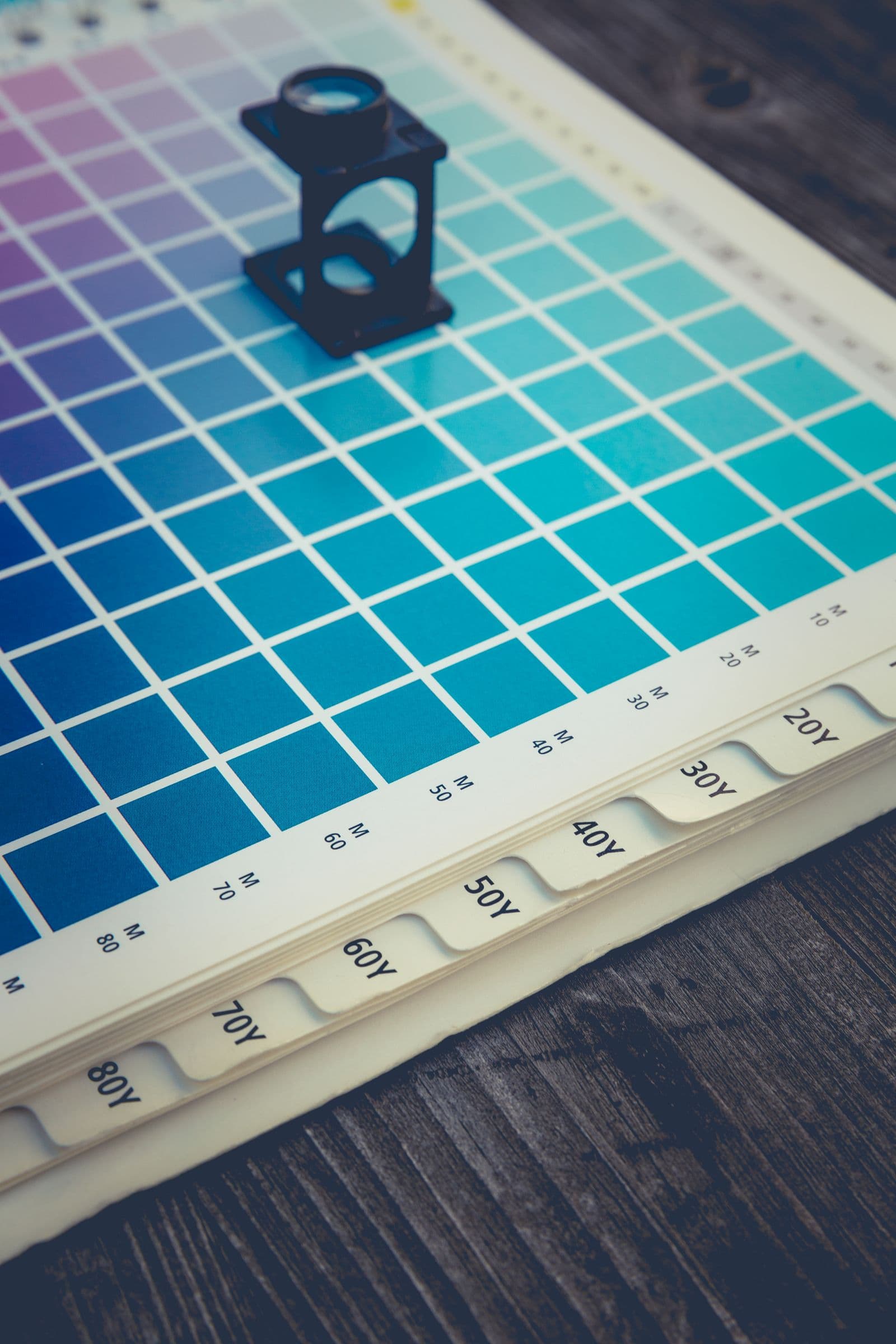 Brand identity design materials laid out on a studio desk