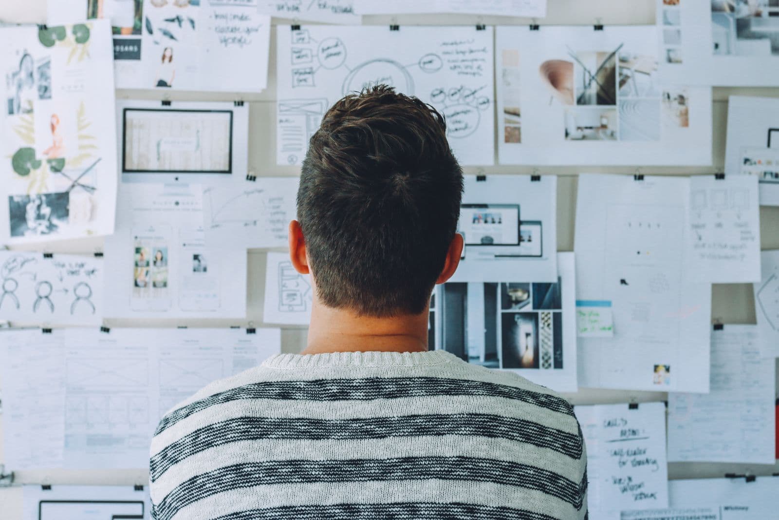 Product designer sketching user interface wireframes